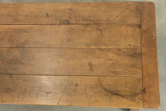 Image 1 of Large antique French farmhouse dining table made of oak from the early 1800s