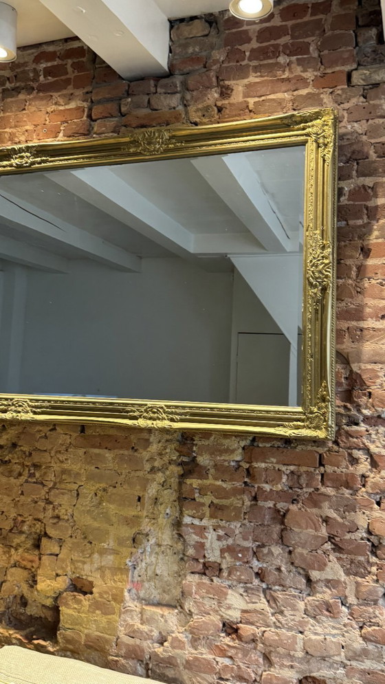 Image 1 of Large gold mirror with a baroque wood frame 