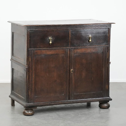Rare English antique 2-door cabinet from the early 18th century with ball feet