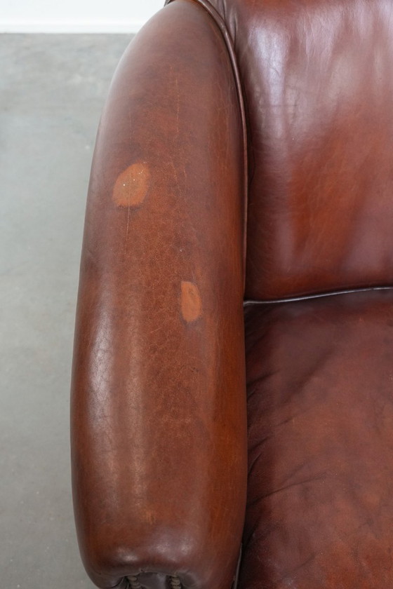 Image 1 of Vintage schapenleren clubfauteuil met siernagels