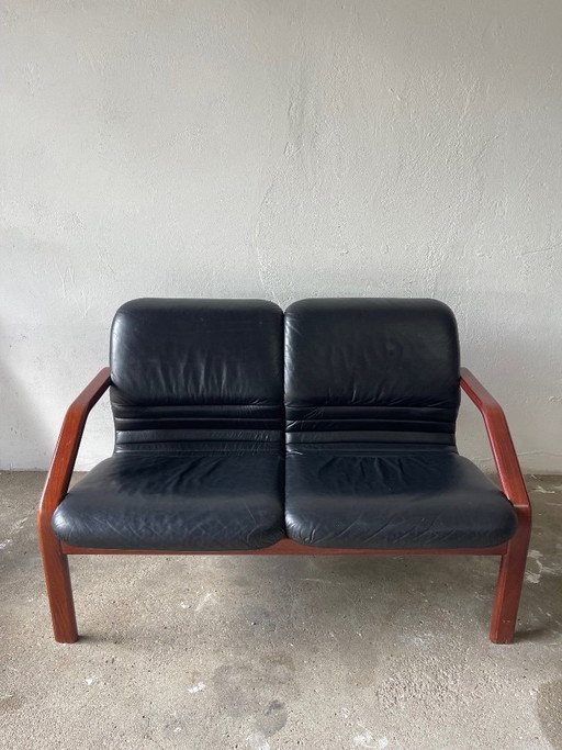 Vintage 2-seater lounge sofa — black leather & solid wood, Italy, 1970s–80s