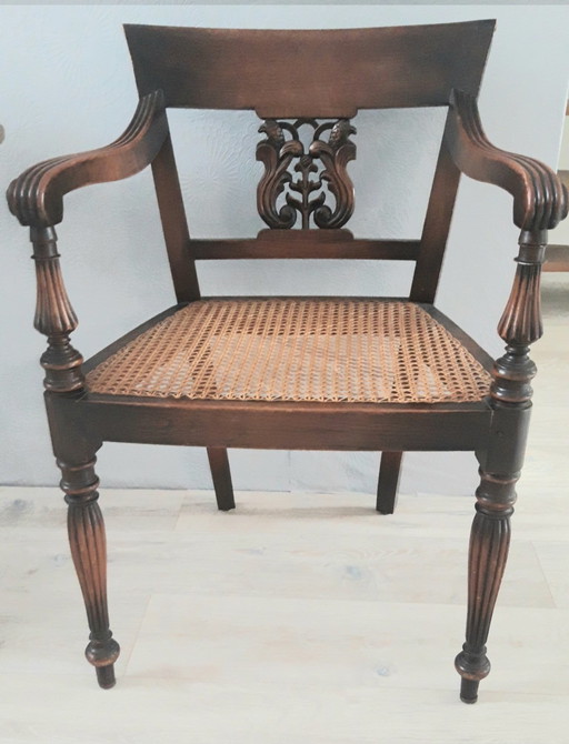 Fantastic Hollywood Regency "Bauer International" mahogany armchair with a webbing seat.