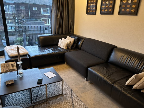 Image 1 of Leolux Faya Lobi corner sofa with loose footstool - black leather and fabric loose element piece