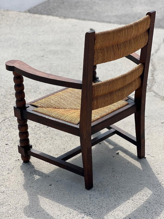 Image 1 of Coppia di poltrone in rovere tinto e paglia, opera francese 1950