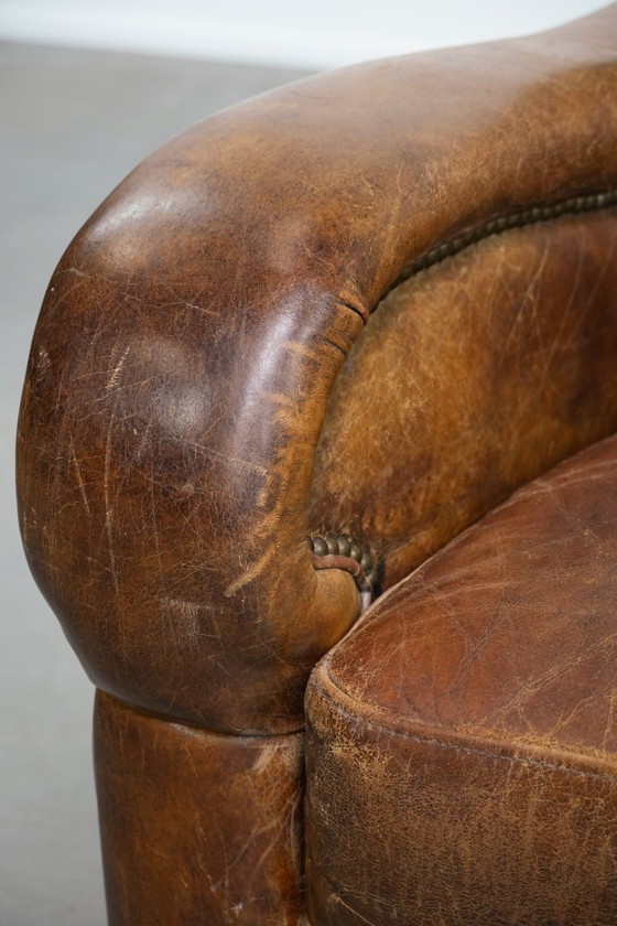 Image 1 of Vintage generfde rundleren fauteuil met ronde vormen