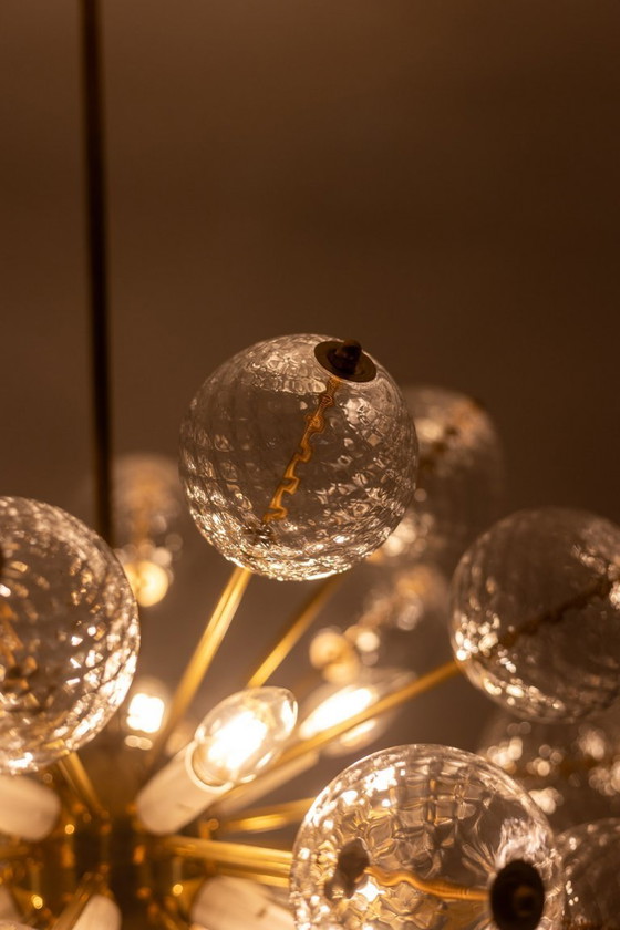 Image 1 of Kamenicky Senov, editor. Pair of brass and glass chandeliers. Circa 1970