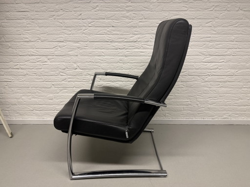 Sillón Topform Design - Piel negra y estructura de acero inoxidable