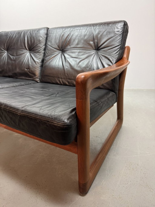 Mid-Century Design Komfort Solid Teak Wooden 3-Seat Sofa with Black Leather Cushions Attributed to Sven Ellekaer by Komfort
