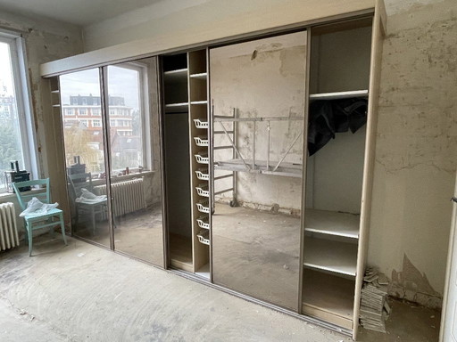 Dressing room with mirrored wardrobe