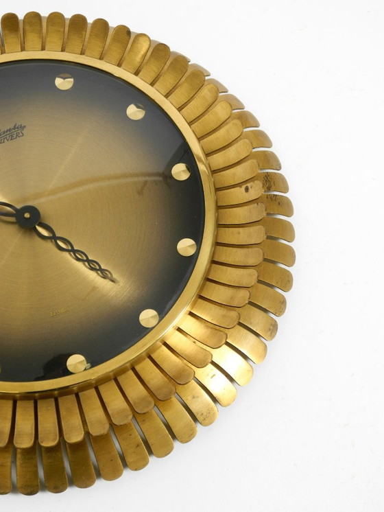 Image 1 of Beautiful original Mid Century Sunburst Atlanta Universe wall clock made of heavy brass with a mechanical seven-day movement