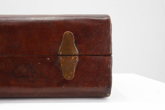 Image 1 of Vintage brown leather suitcase with copper details, China 1900s