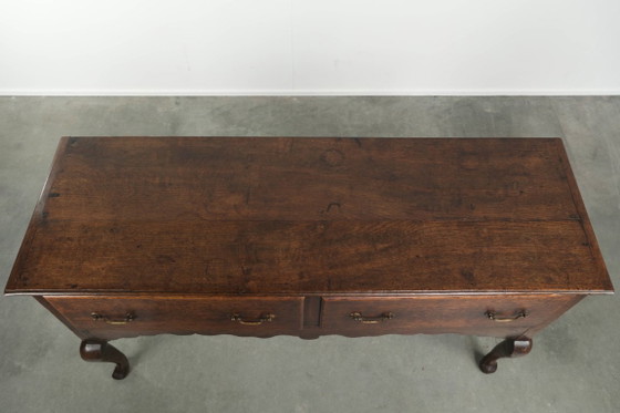 Image 1 of Beautifully sized antique 18th-century English oak dresser/sideboard with brass handles and beautiful colors.