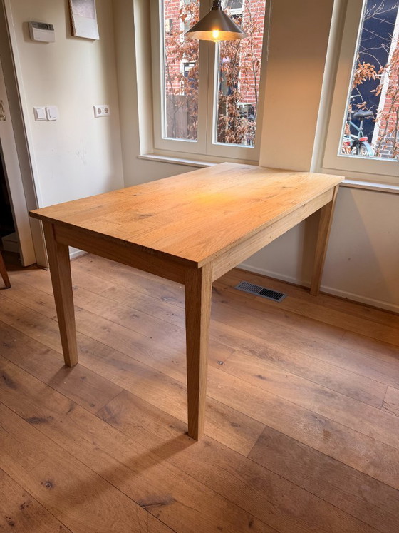 Image 1 of Solid Oak dining table with drawer "framstyle"