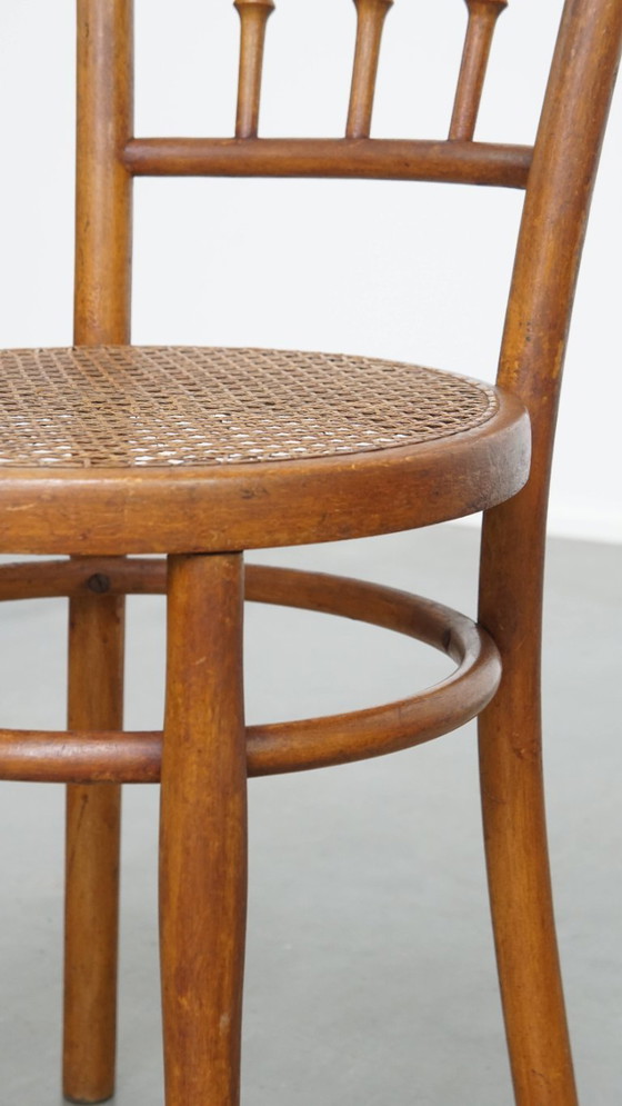 Image 1 of Vintage bistro stoel in de stijl van Thonet met een rieten zitting