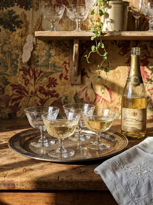 8 Champagne coupes, wheel-engraved glass with vegetal decoration, Bohemia, early 20th century