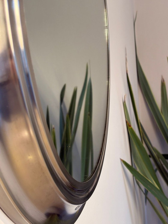 Image 1 of round mirror with metal frame, dating back to the 1970s