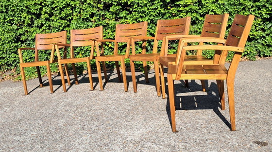 Image 1 of 6 Traditional Teak stacking chairs with armrests