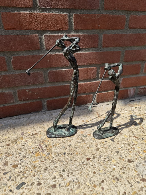 2 real bronze golfers