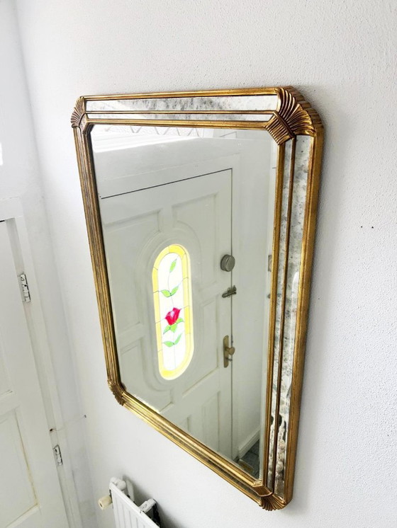 Image 1 of Vintage Deknudt trapezoid mirror – gold frame with smoked mirror glass – Hollywood Regency style – 95 × 69 cm