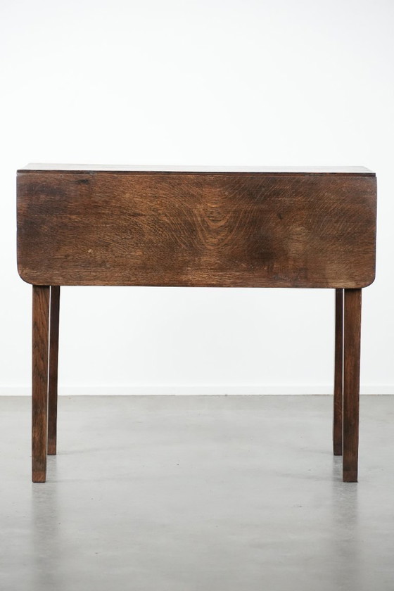 Image 1 of Antique English drop-leaf side/dining table made of oak from the 19th century with a drawer.