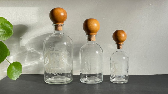Image 1 of Vintage Engraved Glass and Wood Bottles