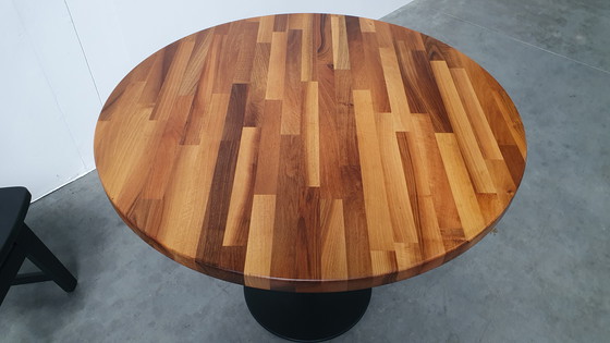 Image 1 of Round mixed wood table 100cm cast iron base Pedrali