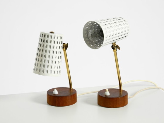Image 1 of A pair of beautiful mid-century modern bedside lamps with perforated metal shades and teak wood bases