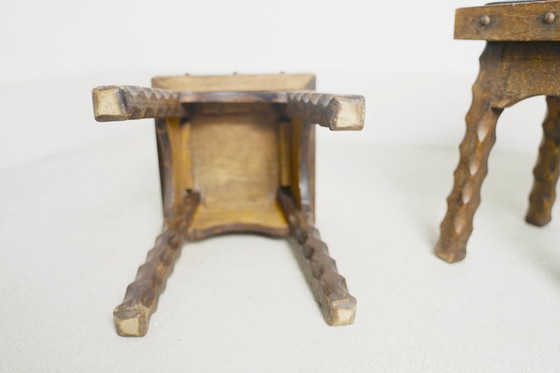 Image 1 of Rustic Oak Stools, 1940s French Hand-Carved Farmhouse Milking Stools, Fireplace Chalet Mountain Decor with Studded Leather Seats