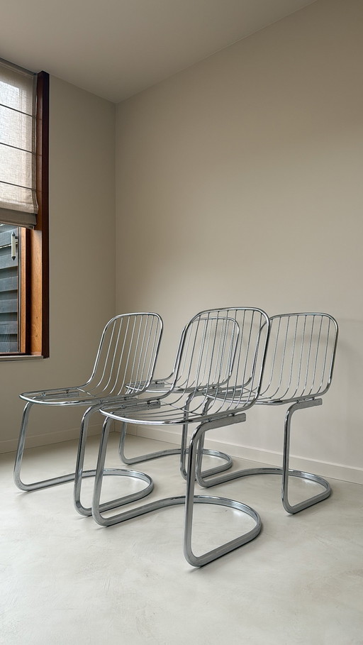 Vier Gastone Rinaldi stoelen verchroomd staal