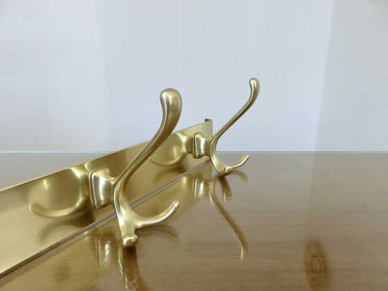 Image 1 of Large wall-mounted coat rack in gilded aluminum, France, 1970