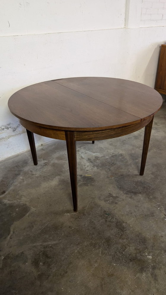 Image 1 of Vintage extendable dining table - round model in teak veneer- mid - Century