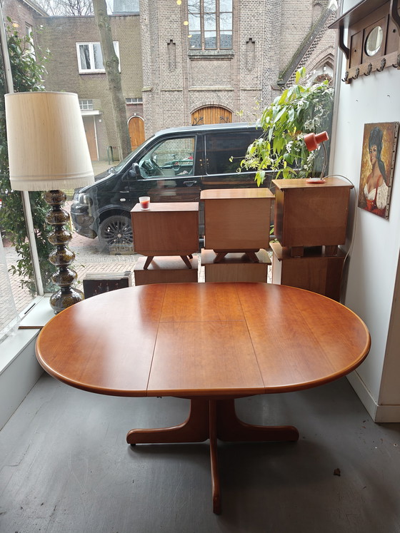 Image 1 of Extendable round to oval dining table