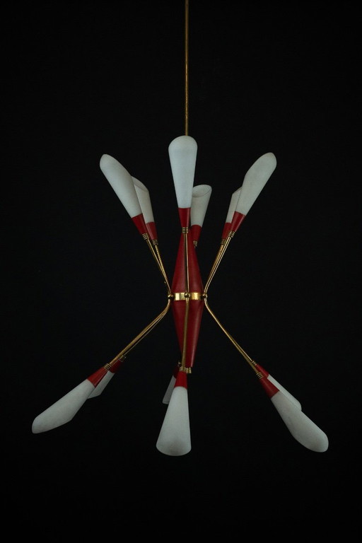 Mid-Century 12 lights chandelier in the manner of Stilnovo. Italy 1950s
