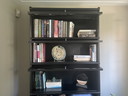 Black bookcase with glass doors and drawers