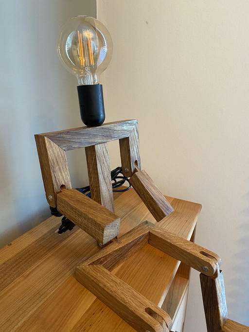 Table lamp in the shape of a little man