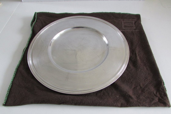 Image 1 of Un plato base plateado de la marca francesa Christofle.