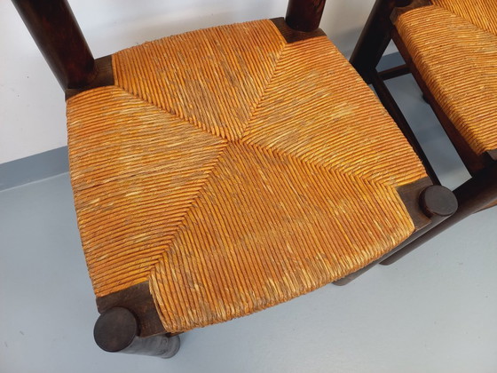 Image 1 of Set van 4 vintage brutalistische stoelen van Georges Robert, gemaakt van hout en stro, uit de jaren 50 en 60.