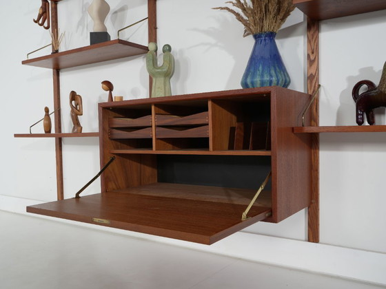 Scaffali a muro modulari Cado, Poul Cadovius, Impiallacciatura in teak, Danese, Anni '70 – Legno (photo 11 of 21)