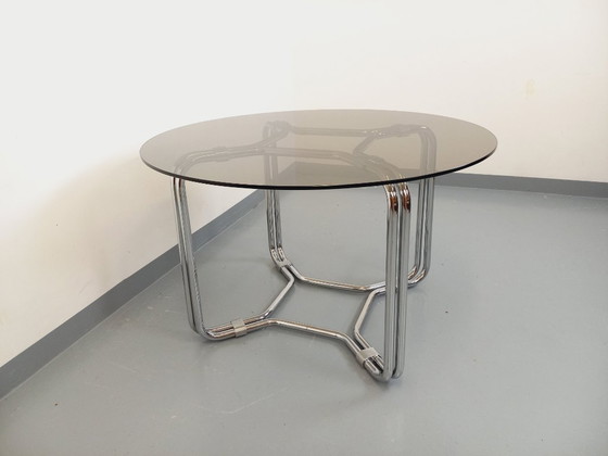 Image 1 of Round vintage dining table in smoked glass and chromed metal in the Space Age style of the 70s