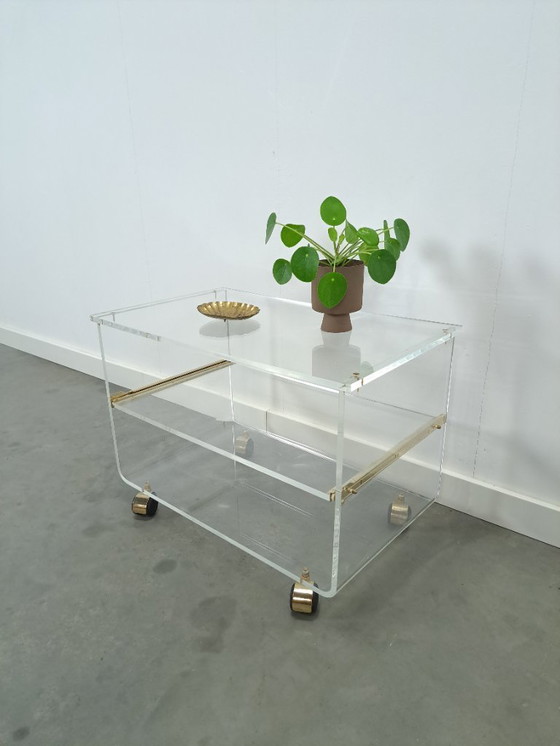 Image 1 of Space age plexiglas trolley met messing