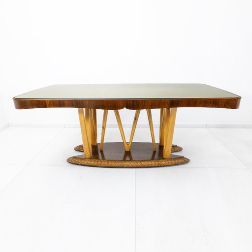 Mesa de comedor italiana de mediados de siglo con tablero de vidrio y base escultural de arce, década de 1950