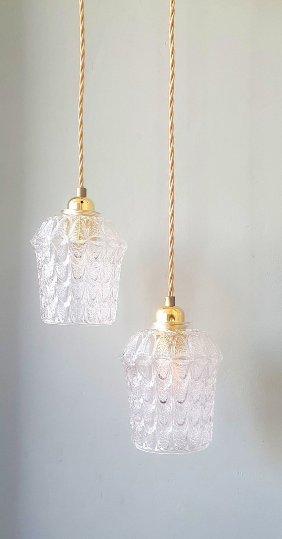 Image 1 of Set of two vintage Mic Century pendant lamps of thick, textured glass.