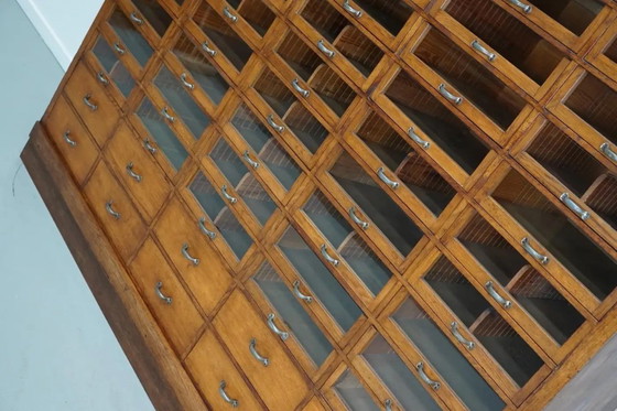 Image 1 of Großer, antiker deutscher Kurzwarenladenschrank aus Eiche, 1940er Jahre