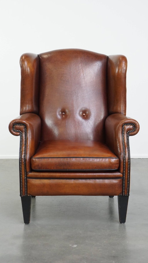 Grote vintage schapenleren oorfauteuil