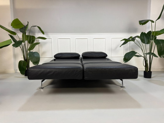 Image 1 of Modèle d'exposition de canapé Brühl Moule en cuir noir avec fonction couchage