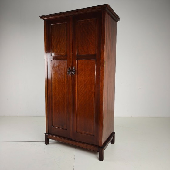Image 1 of Men's clothing by Maple & Co. from the early 20th century.