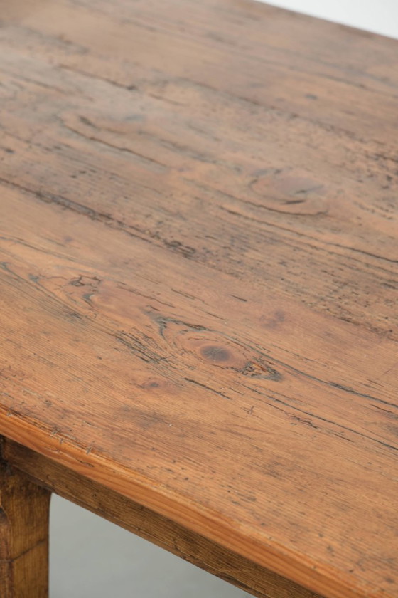 Image 1 of Large, relatively narrow antique French farmhouse dining table made of pine from the early 19th century with a beautiful patina.
