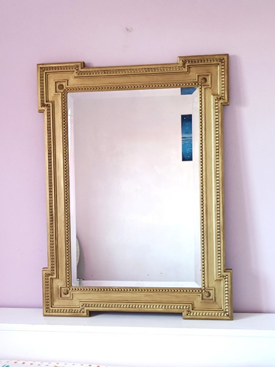 Image 1 of Large antique mirror in gilded wood and beveled glass