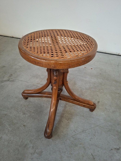 Taburete de piano en haya curvada y paja de Viena