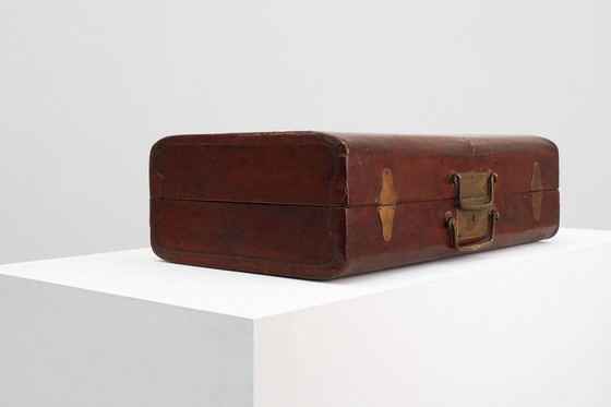 Image 1 of Vintage brown leather suitcase with copper details, China 1900s